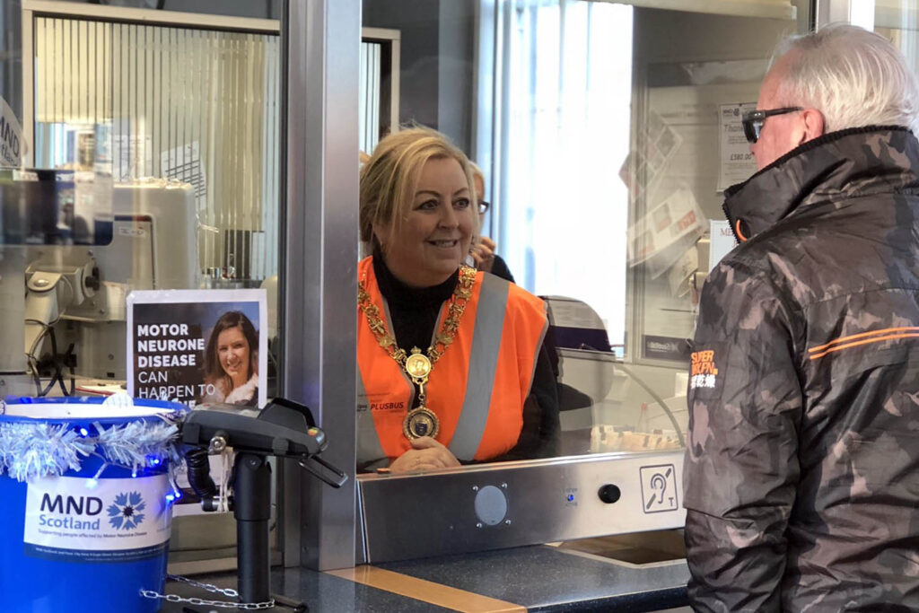 Provost Lorraine Cameron selling tickets in Johnstone Station