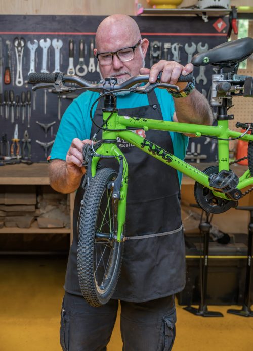 Dave Neill fixing a bike